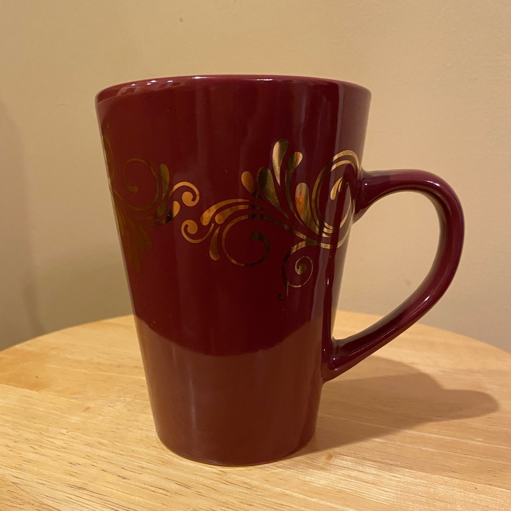 Design Pac red and gold coffee mug.